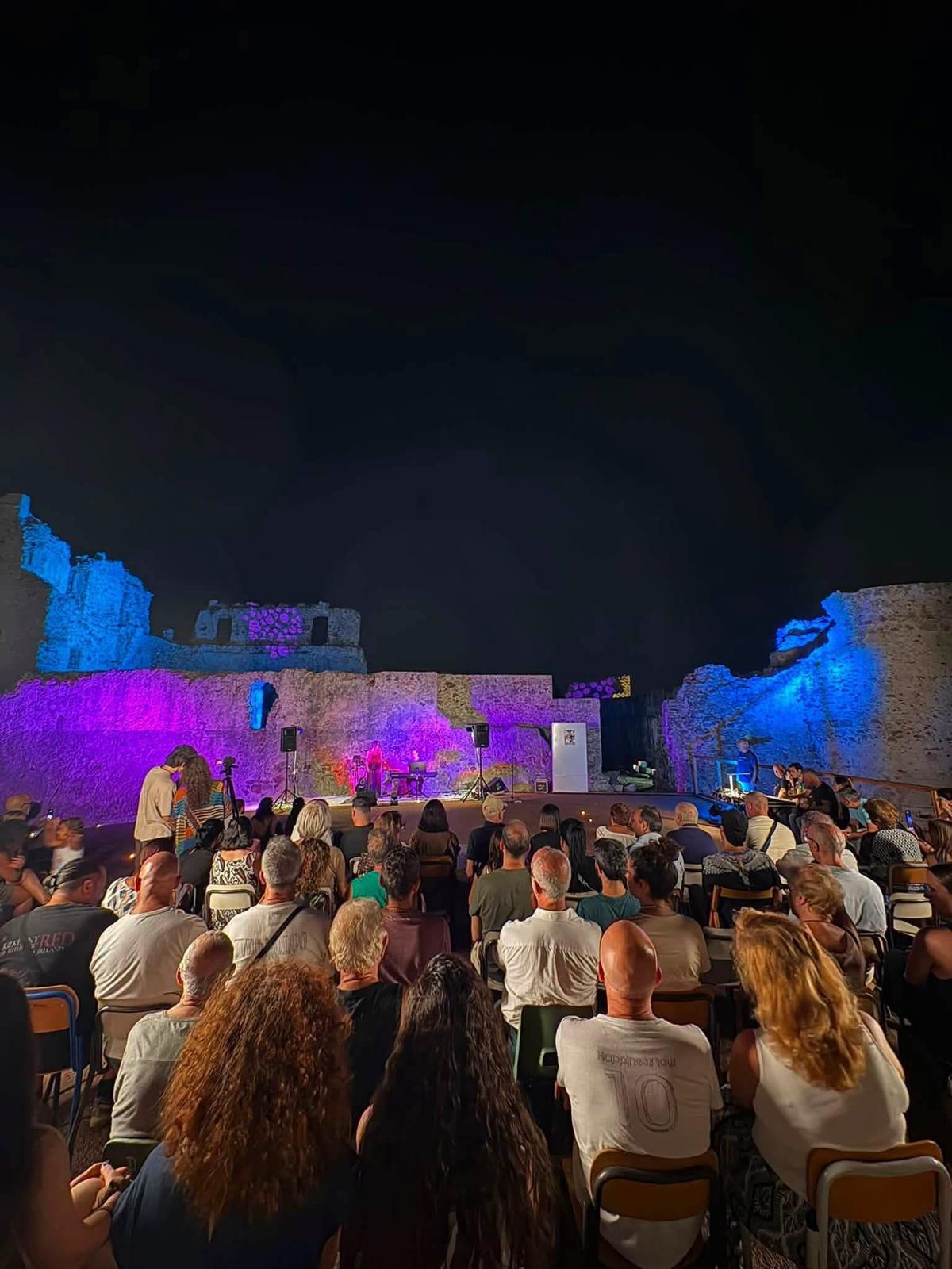 Seated audience in the ruins