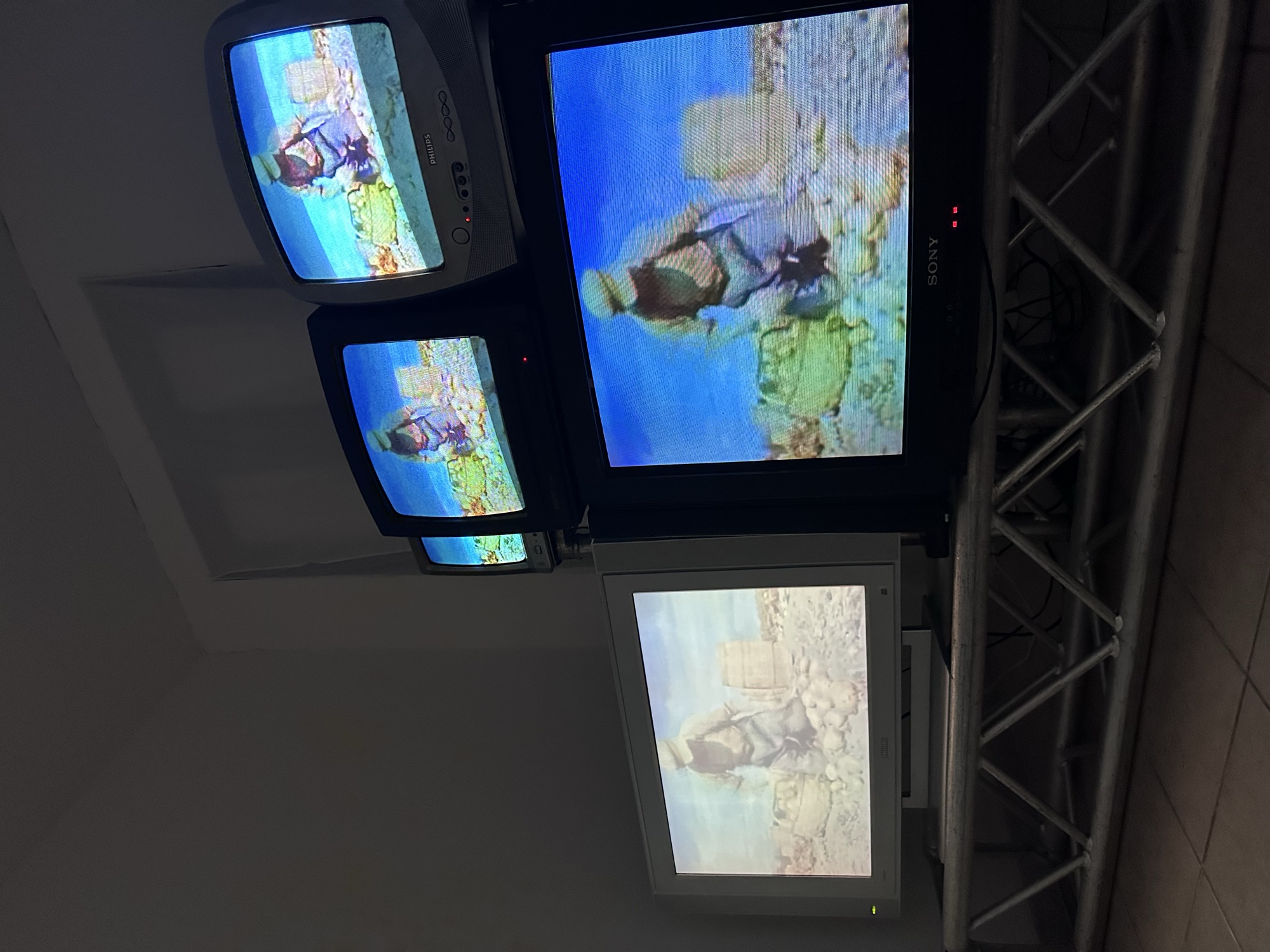 Salvaged CRT televisions stacked into a video wall