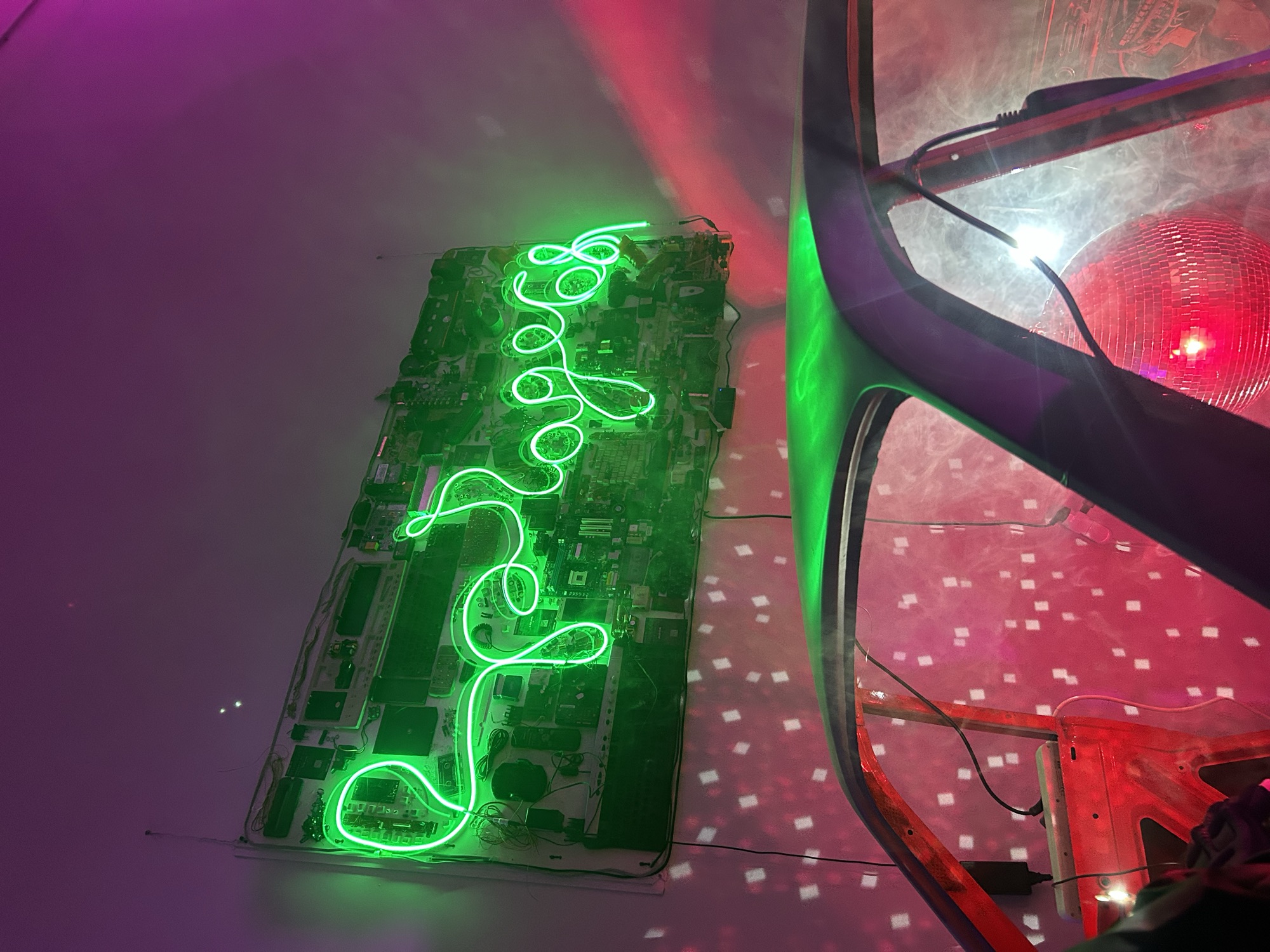 Garage 68 neon sign over a car frame